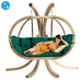 Amazonas globo royal chair in verde green with a person laying